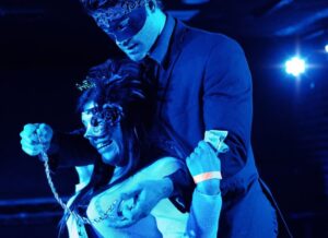 lady participating in the act - fifty shades of grey male strip act